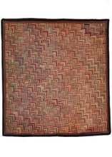 Antique North American square hook rug featuring a multicolored color palette, with an overall warm tone. The pattern is a variation of the classic log cabin design rendered in a way which it is reminiscent of the scales of a fish and that gives the piece added dimensionality. A thin dark brown border frames the whole.