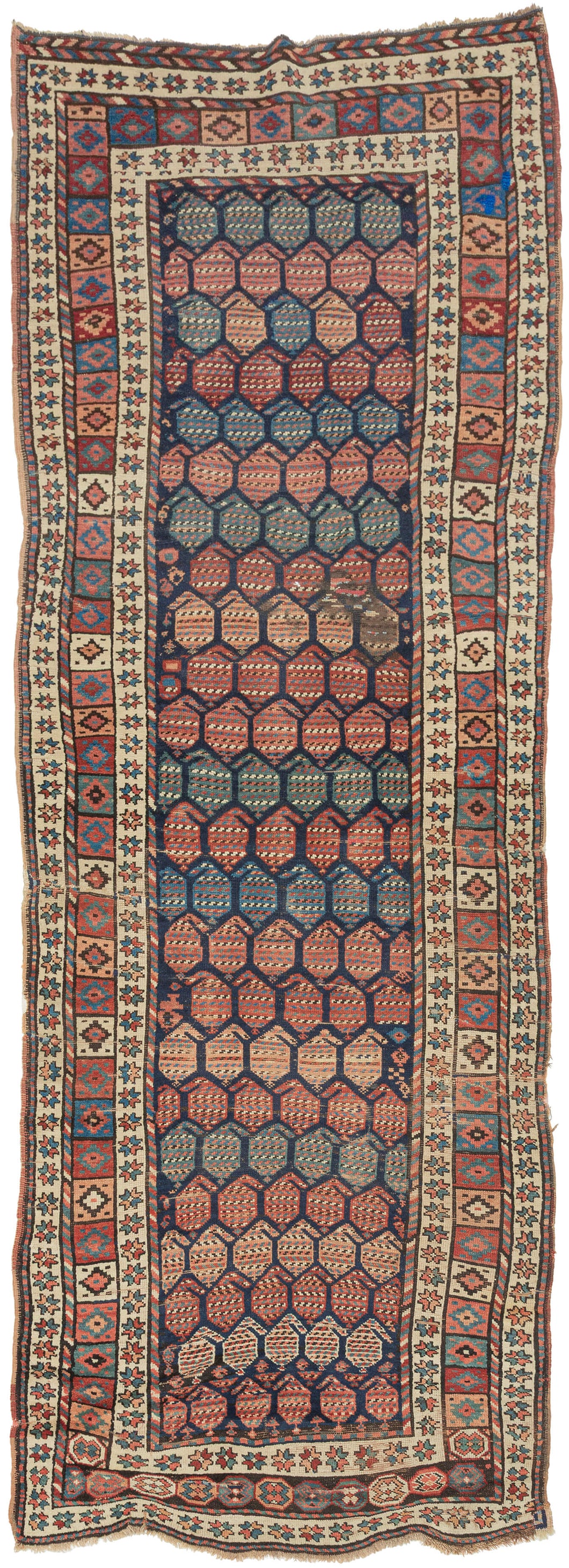 A wonderfully graphic Kurdish rug with a dark indigo field densely packed with rows of large botehs in coral, salmon, blue, green, ivory, and soft brown. Each boteh is filled with fine horizontal patterning, creating a lively surface of shifting color and texture.