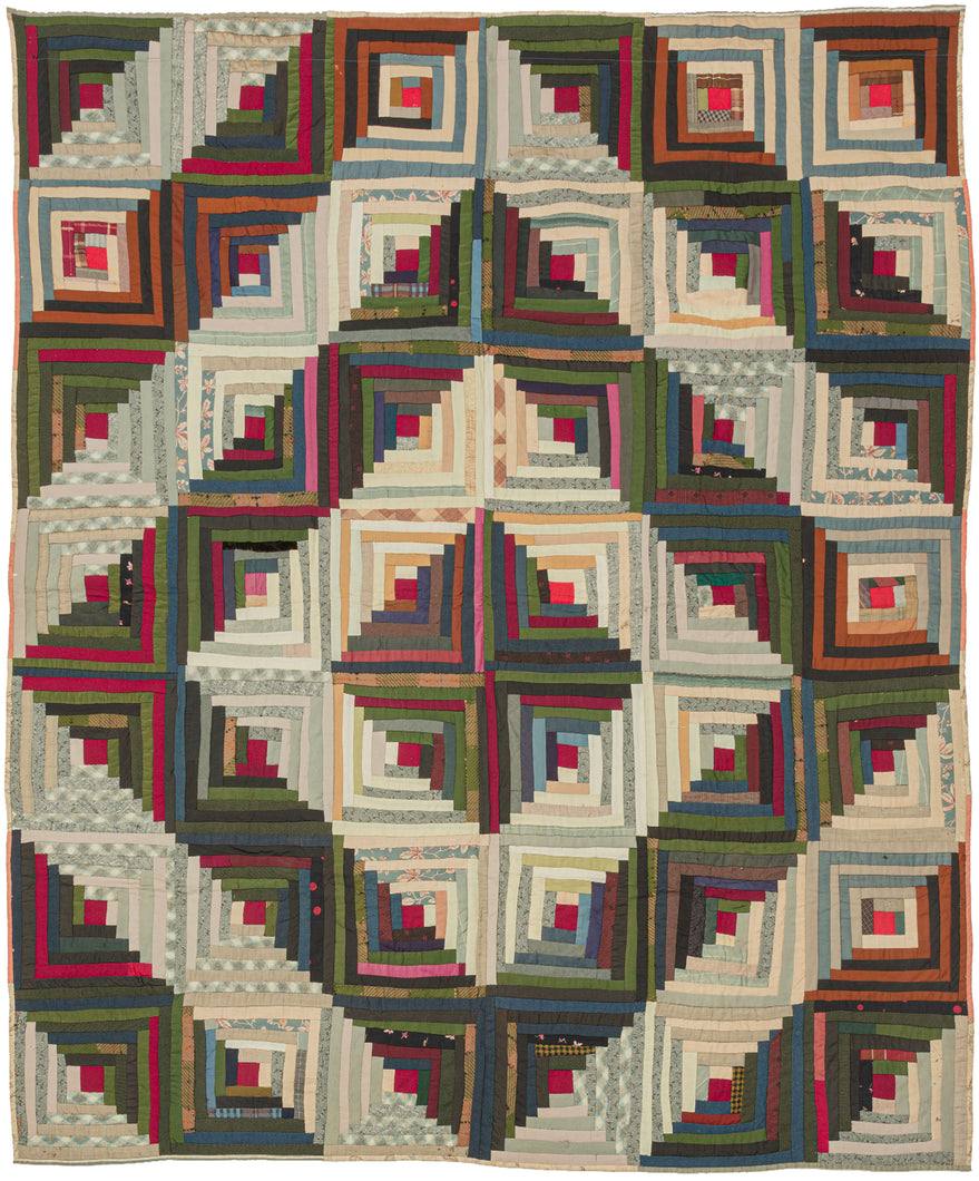 It features a variation of the classic log cabin design in 42 squares. The concentric squares are broken up by a highly contrasting concentric diamond over the top. A very striking composition with great visual power. Would be very impactful hung on a wall. Quilt