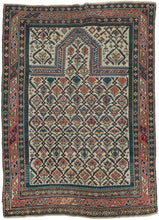 This finely woven late 19th-century Shirvan prayer rug exemplifies the sophisticated graphic language of the eastern Caucasus. Woven on a luminous ivory ground, the field is filled with an elegant lattice of stylized flowering plants and geometric blossoms, creating a rhythmic all-over pattern that is both highly ordered and remarkably lively.