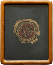 This Coptic textile was woven in Egypt or the Levant in the 5th century AD.&nbsp;

It features a roundel with various vegetal motifs on a rich red ground. It is framed by rounded borders including a main latchhooked border. With tones of green and yellow to go with the classic purplish brown and wheat colored linen classically found in these textiles.&nbsp;