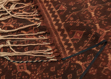 Ende was an important trading post where many cloths were traded including Indian Patola. This cloth is highly influenced by Patola and was created using traditional ikat techniques. A tightly rendered repeat pattern is executed in cotton dyed with indigo and morinda with the cream tinged with morinda from the resist process. A semba is a traditional man's shawl of the indigenous Sikka people of Flores.