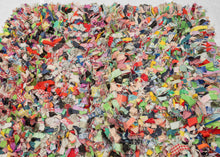 "Cotton and Wool Rag Rug", 2024  Made using recycled fabrics, giving it a distinctive multicolor and shaggy pile. Much of the fabric used features patterning giving the face an explosive feel. The wool wefting on the back of the composition is structured into neat blocks of color offering an excellent&nbsp; juxtaposition to the controlled chaos of the shaggy front. EMMA REDMOND