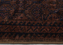 Afghan Baluch lattice design in blue, dusty pink and mauve pink. Plush silky wool with a very dark but lustrous complexion. Framed by an alternating "S" with contrasting sawtooth borders and finished with multiple bands of detailed weft float kilim. Originally intended to be used as a bag, remnants of the goat hair enclosures still survive. 