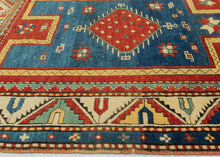 Fachralo Kazak bold contrasting color and open space to striking effect. Primary tones of red, yellow and blue and enhanced with the addition of turquoise and ivory. A simple pattern of rosettes and pinwheels evokes an abstract depiction of bees and flowers. Bees in the Caucasus can symbolize those who collect the 'honey' of traditional wisdom and preserve it for further generations. Top quality dyes to meaty wool to create a balanced and elegant rendering which provokes an emotional response.