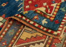 Fachralo Kazak bold contrasting color and open space to striking effect. Primary tones of red, yellow and blue and enhanced with the addition of turquoise and ivory. A simple pattern of rosettes and pinwheels evokes an abstract depiction of bees and flowers. Bees in the Caucasus can symbolize those who collect the 'honey' of traditional wisdom and preserve it for further generations. Top quality dyes to meaty wool to create a balanced and elegant rendering which provokes an emotional response.