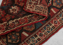 It is woven in soumak weave and features a lattice of polychrome polygons filled with eight pointed stars. The color palette red, blue, yellows, brown and green with bright whites woven in cotton. The whole is framed by a border of diamond filled cartouches.&nbsp;