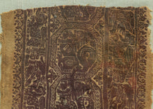 This Coptic textile was woven in Egypt or the Levant in the 4th - 5th century AD.&nbsp;

This large fragment has a highly intricate design rendered in the two classic tones associated with Coptic textiles, purplish brown and wheat. It features a central band of octagons primarily filled with lion-like figures except for one central octagon filled with two figures with extraterrestrial-like features. The central is flanked by two borders full of overlapping and intersecting anthropomorphic figures.