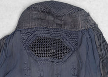 This Burqa was crafted in Afghanistan during the late 20th century.&nbsp;

A burqa is a full-body garment that covers a woman's face and body. This burqa is made of periwinkle blue fabric with crimping around the back and floral embroidery below mesh opening for the eyes.

It is in good condition with small patches and some sun fading.

Special Provenance: Formerly in the collection of Yosi Barzilai Sarajo