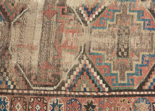 This Kurdish rug was handwoven during the late 19th century.

It features a weathered pattern of polygons filled with memling guls and surrounded by an inner border of eight pointed stars and an outer floral meander border. Wonky village weave with all natural dyes and hearty wool. The wear showcases the rugs use over more than a century and celebrates it materiality by exposing the handspun warps and wefts.