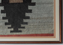 This&nbsp;Navajo rug was woven in the&nbsp;Southwest United States during the 2nd quarter of the 20th Century.

The design is composed of a single black sawtoothed diamond on a heathered gray field. A central sand toned dash and thin blocks of red on the top and bottom add visual interest and dimension. Straightforward yet very moving with a powerful presence. A nice showcase and celebration of Navajo weaving.