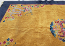 This Art&nbsp;Deco rug was handwoven in Tientsin, China during the second quarter of the 20th century.&nbsp;

This Deco rug features a central dragon surrounded by additional dragons in each of it's four corners all atop an open golden yellow ground framed by a thick unadorned navy border. The scaly and serpentine dragons come in a variety of tones and are each surrounded by colorful cloudbands which emphasize that they are in flight. In China the dragon is often depicted winglessly flying through clouds. I