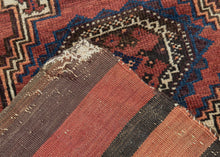 This&nbsp;Baluch rug was handwoven during the early 20th century in Afghanistan.

It features two octagonal Turkmen guls on a red ground and framed by a border of hourglass and cruciform shapes. Rich saturated tones and nice interplay between light and dark. It has original kilim ends on top and bottom that are each embellished with their own weft float pattern. This balisht has it's original kilim back still intact and which employs thick stripes of red, orange, brown and ivory.