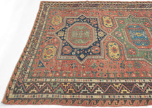 This striking piece is a masterclass in contrast—structural yet supple, bold yet intricate. Woven in the complex weft-wrapping technique characteristic of the Soumak tradition, it showcases a dynamic interplay of serrated medallions, latch-hook forms, and meandering vine motifs and stylized fauna.