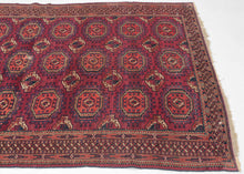 This Tekke Turkmen rug with Saryk aestetics was woven in Turkmenistan during the late 19th century.

It features a repeat field of octagonal main guls and cruciform minor guls on a richly colored &nbsp;plum ground. The back showcases Tekke sensibility, with tightly packed asymmetric knots, high warp depression, and deeply toned red wefting—all hallmarks of classic 19th-century Tekke craftsmanship. The borders are dense and harmonious, filled with geometric detailing and anchored by elegant guards. An elegan