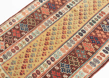 This Talish runner was handwoven during the late 19th century in the Caucasus.

It features narrow field of rows of shrubs on a rare and desirable yellow ground. The shrubs are laid out in diagonal columns which are rendered in rich reds and blues and green jewel tones. It is framed by a wide main border of both small and geometric rosettes on a chocolate ground.
