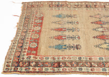 A rare and evocative Kurdish weaving that was likely woven in as a Sufi meditation mat. The design centers around an open camel-hair field punctuated by two registers of stylized cypress or tree-of-life motifs, symbolizing spiritual ascent and resilience.&nbsp;A single red vertical stripe flanking one edge subtly functions as a mihrab, orienting the user without the overt architecture of a classic prayer rug. This quiet asymmetry and spiritual intention suggest a meditative or mystical use, likely in a Sufi