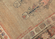 A rare and evocative Kurdish weaving that was likely woven in as a Sufi meditation mat. The design centers around an open camel-hair field punctuated by two registers of stylized cypress or tree-of-life motifs, symbolizing spiritual ascent and resilience.&nbsp;A single red vertical stripe flanking one edge subtly functions as a mihrab, orienting the user without the overt architecture of a classic prayer rug. This quiet asymmetry and spiritual intention suggest a meditative or mystical use, likely in a Sufi
