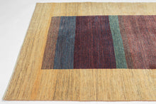 A refined example of modern Gabbeh weaving, this piece offers a minimalist meditation on color and form. Bands of saturated burgundy, indigo, and green move across a central panel, grounded by a glowing yellow field that frames the composition with quiet elegance.

Gabbeh rugs are known for their thick wool, subtle variegation, and expressive use of natural dyes. This example distills those elements into a bold yet harmonious design that is both rooted in tradition and strikingly modern.
