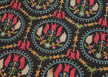 This embroidered textile is a well-preserved example of late Ottoman Armenian domestic needlework, likely produced in the town of Marash (modern-day Kahramanmaraş, Turkey) at the turn of the 20th century. &nbsp;

The embroidery is executed in silk floss using satin and couching stitches across a black cotton ground.&nbsp; It features concentric floral medallions, stylized birds and serrated leaves in lively blues, greens, red, pink, purple, yellow and ivory. Notably, two guardian-like anthropomorphic figure