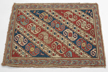 This finely woven Soumak was woven in the Kuba region of the eastern Caucasus during the late 19th century.&nbsp;

The field is composed of dynamic diagonal bands filled with stylized zoomorphic and geometric motifs that are often interpreted as abstract dragons and set against alternating red, ivory, and blue grounds. These bands are interspersed with charming and symbolic filler elements like tiny birds and floral motifs that animate the composition with delightful irregularity.
