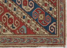 This finely woven Soumak was woven in the Kuba region of the eastern Caucasus during the late 19th century.&nbsp;

The field is composed of dynamic diagonal bands filled with stylized zoomorphic and geometric motifs that are often interpreted as abstract dragons and set against alternating red, ivory, and blue grounds. These bands are interspersed with charming and symbolic filler elements like tiny birds and floral motifs that animate the composition with delightful irregularity.