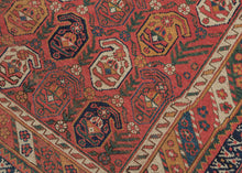 19th century It features a field of scrolling vines topped with wide blossoming botehs red, stark white, navy, indigo, and a desirable golden yellow on a red ground. It is surrounded by borders of bent ribbons, diagonal stripes and most prominently a dinosaur-like primitive bird border. This group of Afshars is thought to be woven in the Aqta region and have taken their patterning from nearby Kerman shawls. Nicely finished with striped kilim skirt borders on the top and bottom.