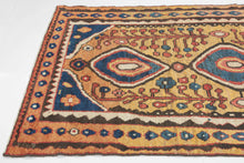 This vibrant Gabbeh was woven by the Qashqai during the 2nd quarter of the 20th century

The design centers on bold concentric diamond medallions floating on a warm saffron field. The medallions are flanked by playful flowering shrubs and framed by a charming rosette border. The palette is exceptional: saturated indigo, terracotta, sky blue, and emerald green, all rendered in luminous natural dyes.