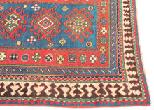 This Kazak was handwoven during the early 20th century in the southwest Caucasus.

A beautifully drawn Kazak featuring a chain of hooked diamond medallions on a vibrant sky-blue field. Each medallion is filled with either concentric diamonds or rubik's cube like grid in ivory, saffron, madder red, and deep indigo. Scattered rosettes and small geometric motifs animate the field, creating a lively rhythm. The border system is classic and powerful with an ivory “ram’s horn” outer border that encloses a richly 