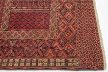 This finely woven Tekke ensi, or door rug, was woven in Southern Turkmenistan during the early 20th century. Its composition follows the traditional four-panel layout divided by a vertical and horizontal axis in a classic Hatchli format. Within each quadrant, stylized tree motifs rise in rhythmic symmetry as abstracted forms that may signify fertility, life, and renewal within the enclosed domestic world.