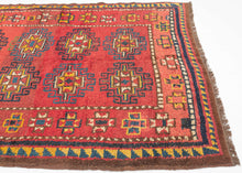 This Kurdish Yatak was handwoven in Eastern Anatolia during the late 19th century.

A vibrant and expressive Kurdish Anatolian Yatak, woven in the highland villages of Eastern Anatolia and originally intended as a sleeping or bedding rug. The format is classic with a warm, saturated red field filled with a rhythmic repeat of memling guls outlined in deep indigo and enlivened with saffron, ivory, moss green, and brick tones. The drawing is bold and spontaneous, full of angular hooked outlines and charming tr