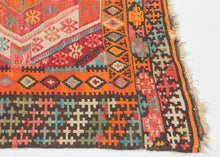 This kilim was handwoven in the Konya–Karapınar region of Central Anatolian during the late 19th century.

A radiant piece with an explosive palette and a beautifully articulated double-medallion composition. The weaver layers crimson, apricot, madder rose, turquoise, soft greens, and ivory into a shimmering, prismatic field. These hues create a depth and warmth that are unmistakably Anatolian.