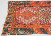 This kilim was handwoven in the Konya–Karapınar region of Central Anatolian during the late 19th century.

A radiant piece with an explosive palette and a beautifully articulated double-medallion composition. The weaver layers crimson, apricot, madder rose, turquoise, soft greens, and ivory into a shimmering, prismatic field. These hues create a depth and warmth that are unmistakably Anatolian.