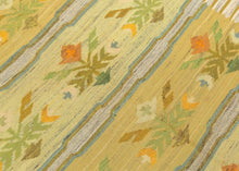 This Rölakan was handwoven in Sweden during the middle of the 20th Century.

A beautifully balanced Scandinavian flatweave featuring soft, luminous tones of straw yellow, pale green, sky blue, and warm ochre. The design is arranged in horizontal bands of stylized floral motifs, framed by subtle striped edges in an unmistakable nod to mid-century Swedish weaving traditions. The palette is intentionally gentle and airy, giving the piece a fresh, understated presence that works effortlessly in contemporary int