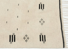 Saltillo serapes are typically celebrated for their explosive color and serrated diamonds, yet this example embodies a far rarer aesthetic restraint. Its monochrome palette highlights the quality of the hand-spun wool and gives the textile a modern presence that feels at home in both historical collections and contemporary interiors.


The graphic language here anticipates the design vocabulary that would later define Mexican modernism. The patterning resonates especially with the iconic Mexico City Olympic