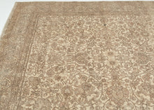 A softly washed-out mid-century Sivas rug handwoven in central Anatolia, featuring an even, atmospheric palette and a finely detailed floral field. The original drawing remains legible yet subdued, creating a gentle, almost parchment-like surface where pattern and ground merge into a cohesive whole. Subtle animal figures are interwoven within the scrolling arabesques, revealing themselves gradually and rewarding closer looking.