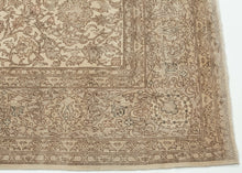 A softly washed-out mid-century Sivas rug handwoven in central Anatolia, featuring an even, atmospheric palette and a finely detailed floral field. The original drawing remains legible yet subdued, creating a gentle, almost parchment-like surface where pattern and ground merge into a cohesive whole. Subtle animal figures are interwoven within the scrolling arabesques, revealing themselves gradually and rewarding closer looking.
