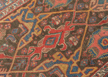 A confident&nbsp;Bidjar with a saturated red field and bold geometric medallion composition. Angular motifs in indigo, ivory, and saffron are crisply articulated, creating a dynamic interplay of symmetry and movement across the surface.