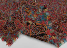 19th century square Kashmir kani shawl with dense red boteh (paisley) design, joined panel construction, and a central woven inscription cartouche in stylized Persian script, with intricate borders and multicolor fringe.