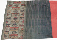 A finely woven woman’s skirt associated with Tai-speaking communities of northern Laos and northwestern Vietnam.

The textile is constructed in three distinct sections with a red cotton waistband, a dark indigo body enlivened with subtle horizontal striping, and an intricately patterned lower panel. The restrained palette of indigo, cream, ochre and red gives the skirt an unusually graphic quality.