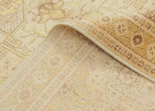An elegant mid-20th-century Tabriz carpet distinguished by its intricate allover design and softly washed palette.

The field is organized as a continuous lattice of interlocking angular compartments, alternating with floral medallions, palmettes and smaller geometric devices. The tightly fitted shapes create an almost tessellated rhythm across the surface, balancing strong architectural structure with delicate vegetal drawing.