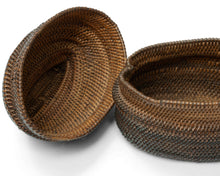 A finely made lidded basket attributed to the Kuba peoples of the Democratic Republic of the Congo, tightly plaited from raffia palm fiber and finished with a fitted cover and raised woven grip.