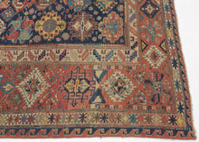 A richly patterned Soumak from the northeastern Caucasus, woven in the 19th century with an unusually varied assortment of boldly drawn floral and geometric forms.

The deep indigo field is densely populated with stylized palmettes, rosettes, blossoms and angular vegetal devices, individually rendered in saturated shades of madder red, blue, green, ivory and golden yellow. The floral vocabulary closely recalls the celebrated Kuba “blossom” rugs, whose fields are similarly animated by large, colorful palmett