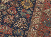 A richly patterned Soumak from the northeastern Caucasus, woven in the 19th century with an unusually varied assortment of boldly drawn floral and geometric forms.

The deep indigo field is densely populated with stylized palmettes, rosettes, blossoms and angular vegetal devices, individually rendered in saturated shades of madder red, blue, green, ivory and golden yellow. The floral vocabulary closely recalls the celebrated Kuba “blossom” rugs, whose fields are similarly animated by large, colorful palmett