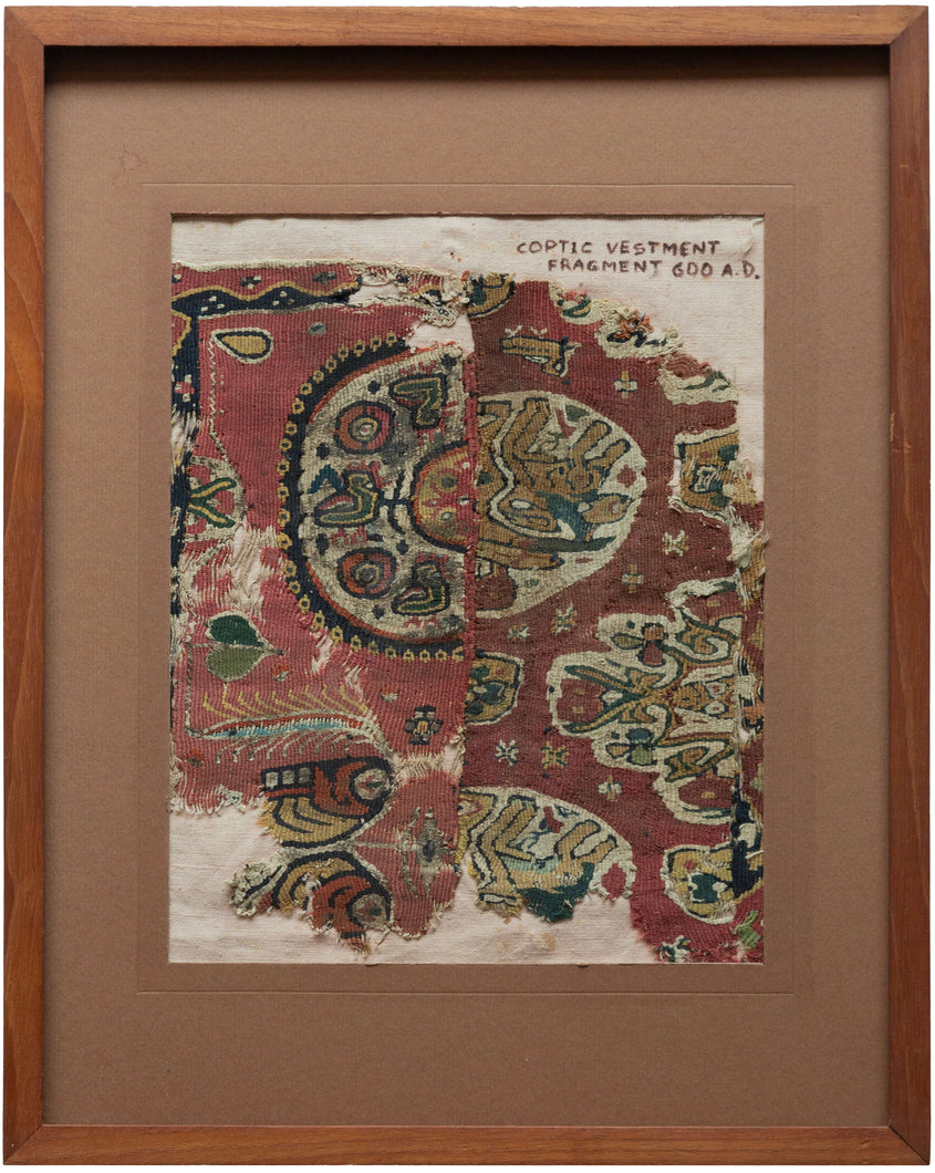 This Coptic textile was woven in Egypt or the Levant in the 6th century AD. 

It features what appear to be two unrelated fragments with a similar palette and age that are displayed together. A nice study piece showcasing the variety of motifs and styles during the period. 