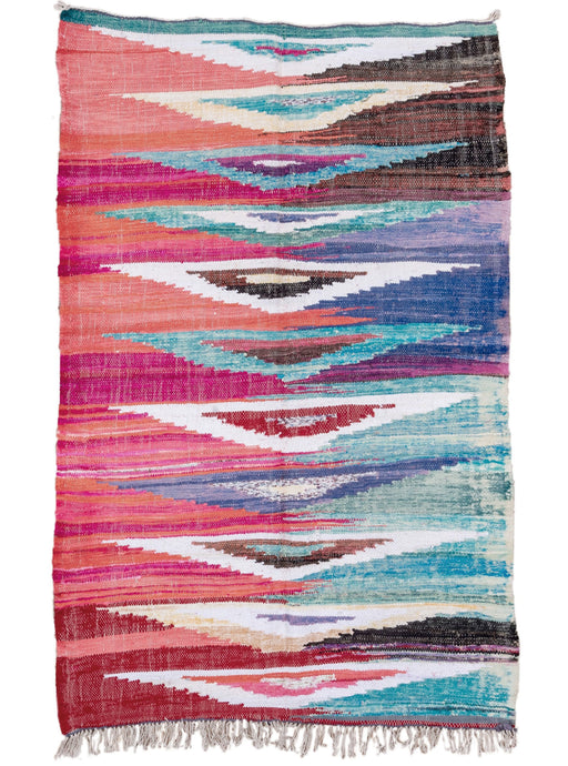 contemporary moroccan This colorful kilim features abstracted shapes in a bright and cheerful palette of pink, purple, turquoise, ivory and brown. A classic rag rug made of mixed materials but rendered here in flatweave. the assymetric use of color gives adds a wild touch.