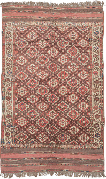 This Anitque Yomud Turkmen Rug features an allover design of red and white 