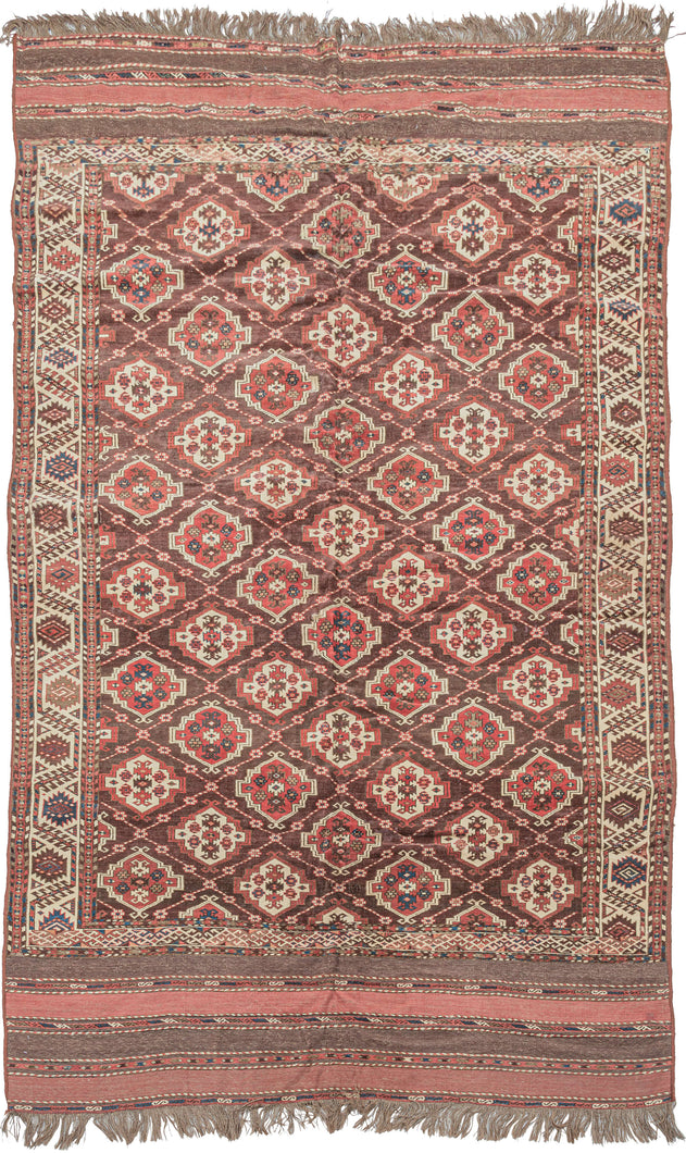 This Anitque Yomud Turkmen Rug features an allover design of red and white 