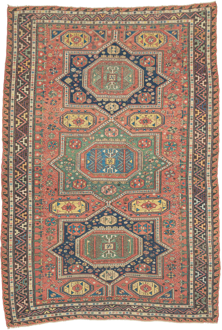 This striking piece is a masterclass in contrast—structural yet supple, bold yet intricate. Woven in the complex weft-wrapping technique characteristic of the Soumak tradition, it showcases a dynamic interplay of serrated medallions, latch-hook forms, and meandering vine motifs and stylized fauna.
