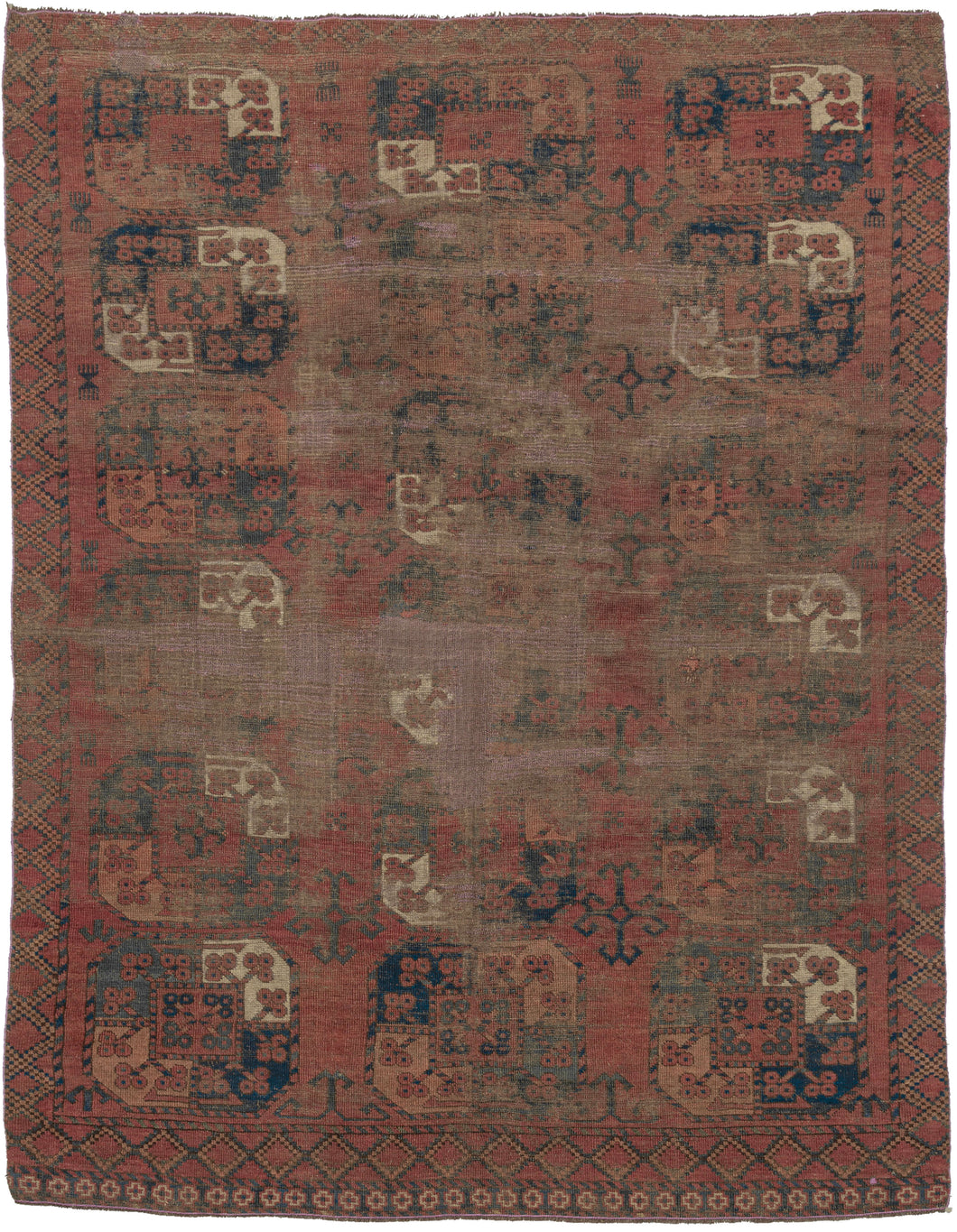 SILK KINTSUGI A soulful early Ersari Turkmen rug, measuring with a beautifully aged surface and a striking contemporary repair. The field is arranged with large-scale Turkmen guls in a soft, time-muted palette of deep red, brown, indigo, charcoal, and ivory. Years of wear have softened the design, giving the rug a quiet, atmospheric quality while still preserving the rhythm and strength of its original tribal composition.